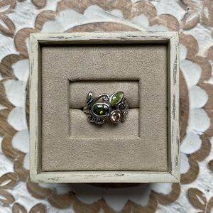 Ring with green and peach stones